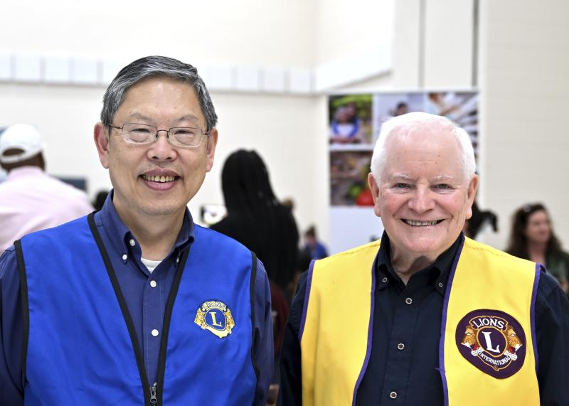 Tommy Lu and John Monahan are on hand to represent the Lions Club with pride.